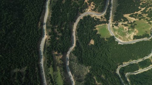 Motorcyclists Driving Along Mountain Serpentine Drone View