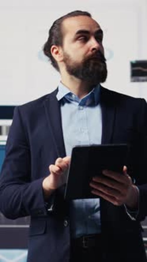 Vertical Video Business Expert Reflecting on Monthly Performance Metrics on Dashboards