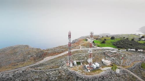 Island with communications tower on hill