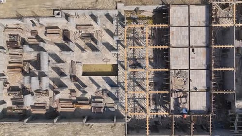 Aerial View Construction Project in Progress Team of Workers and Heavy Equipment