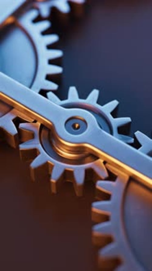 Loop-Animation einer mechanischen Struktur aus Metallzahnrädern.