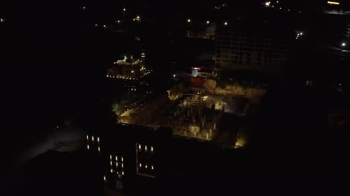 Slider Drone Shot Of Construction Building At Night