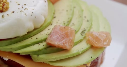 Gourmet Sandwich with Avocado, Salmon, and Poached Egg