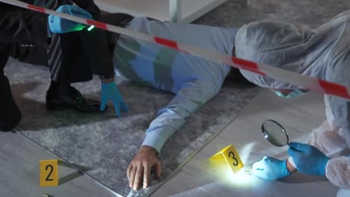 Investigators Examining Evidence at Crime Scene