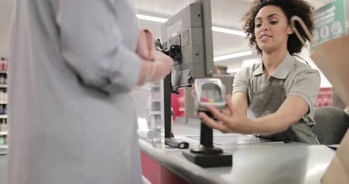 Sales clerk working at grocery store