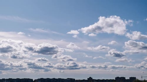 Storm Clouds Moves Over The Silhouettes of High Rise Buildings Roofs Timelapse