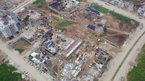 Large residential construction site with cranes, Aerial view