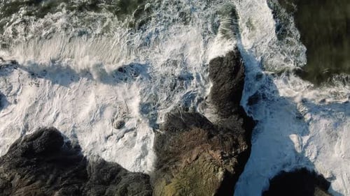 Drone Top View Of Amazing Ocean Landscape With Waves Crashing Rocks