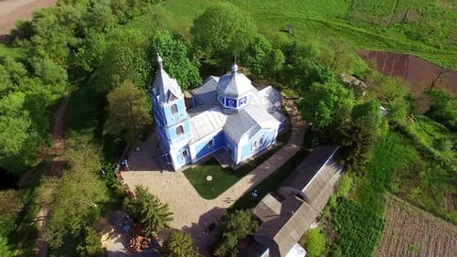 Beautiful building of a church surrounded by green trees.