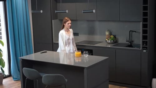 Stylishly Modern and Sleek Kitchen Interior Featuring an Island and a Minimalist Design Approach