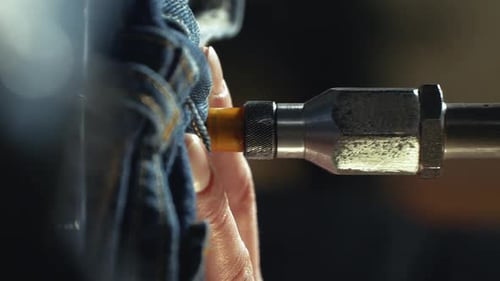 Close Up Denim Manufacturing with Metal Component