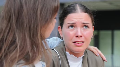 Upset Woman Sharing Her Problems with a Comforting Friend in an Emotional Depicting Support Empathy