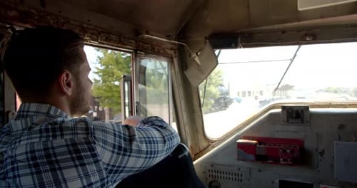 Man sits aboard santa fe train at wichita Kansas great plains transportation museum