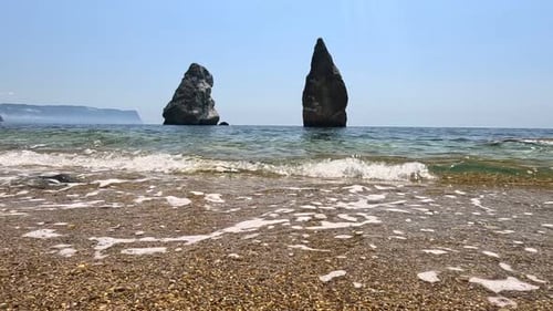 Small Sea Wave Blurred Soft Foamy Waves Washing Golden Sandy Beach and Volcanic Rocky Shores Nobody