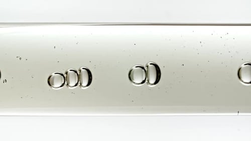 Macro Abstract Transparent Bubbles Moving in Glass