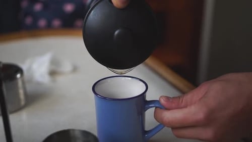 Man Preparing Coffee with a French Press
