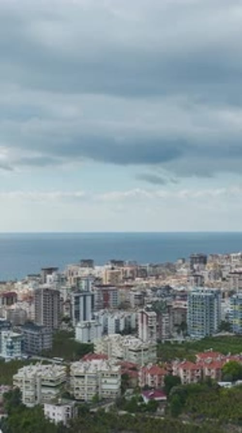 Vertical Video Small Town on the Mediterranean Shore Captured Vertically With Clear Skies and Ocean