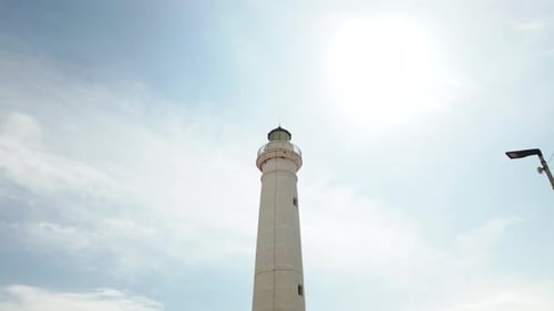 Lighthouse Tower Under Clouds Timelapse