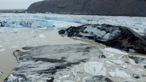 Aerial flight over dramatic Vatnajökull glacier in Iceland with glacial lake