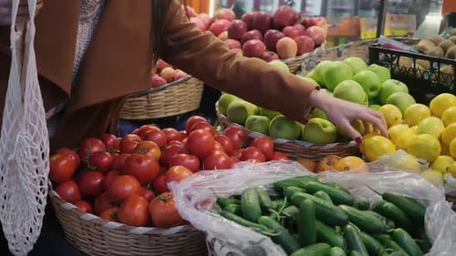 Young Woman Choosing Lemons at Fruit Vegetable Shelf in Grocery Store Healthy Food Nutrition