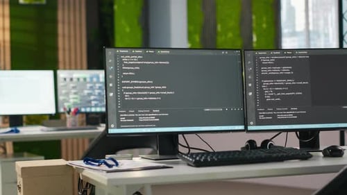 PC Screens on Office Desk Used to Design and Implement AI Algorithms