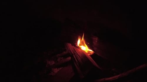Campfire burning at night in Iceland.