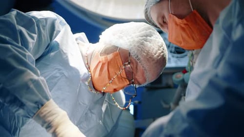 Surgeons Performing Operation in Operating Room