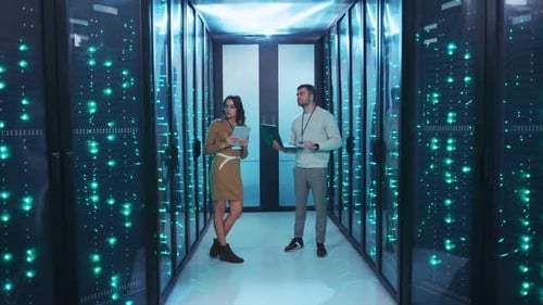 Two Experts Standing in a Server Room