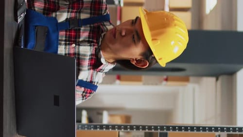 Vertical Video Young Man Planning Order Shipment in Storehouse