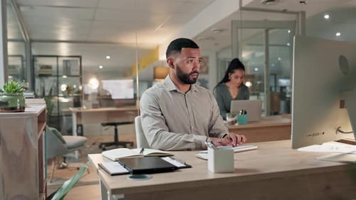 Computer, research and a business man writing in his notebook while planning in the office at night