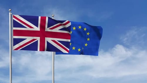 United Kingdom and European Union Flags Waving Against a Blue Sky