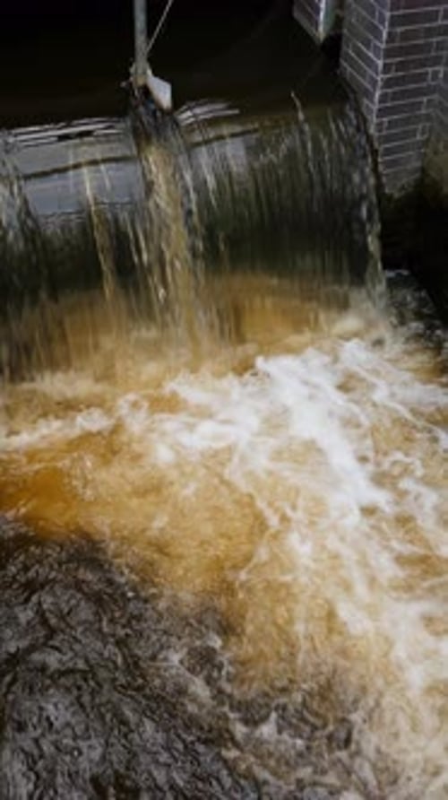 Water Flowing from Concrete Structure Creates Whitewater