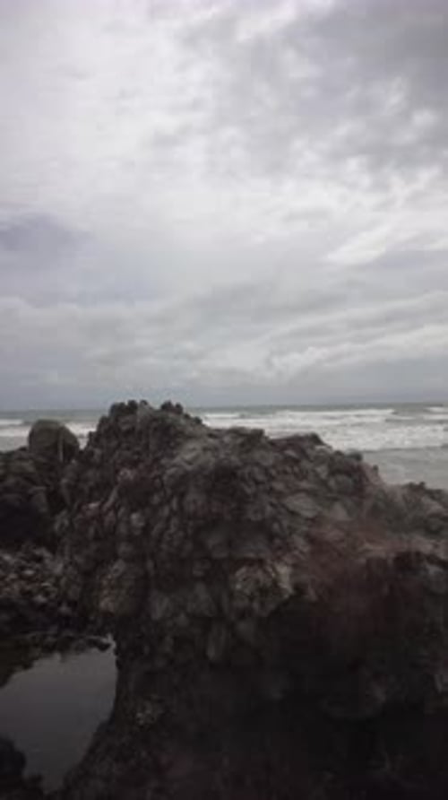 vertical video of beachside views, natural panoramas, sea water accompanied by crashing waves