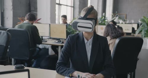 Businesswoman with VR Headset in Modern Office