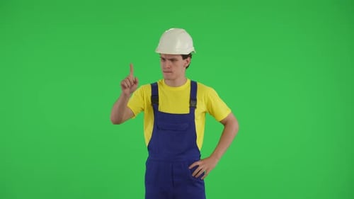 Medium Green Screen Isolated Chroma Key Video of a Young Construction Worker Swiping Tapping and