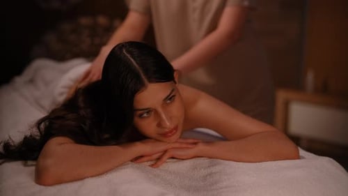 Woman Receiving Relaxing Massage at Spa