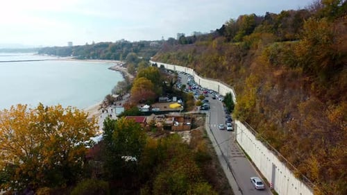 Aerial drone view of road parallel to the sea. Aerial view on sunny day