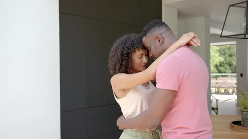 Young Couple Share a Loving Embrace at Home