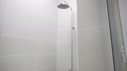 Clean Bathroom Shower With White Tiles
