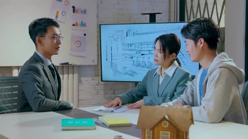 Business partners to open a company together, shaking hands after signing contract at glass table