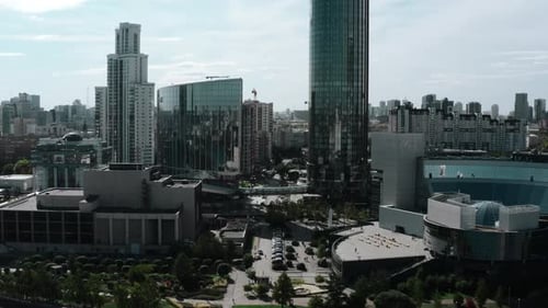 Daytime landscape shot from a helicopter. Stock footage. A bright view of a huge city with high-rise