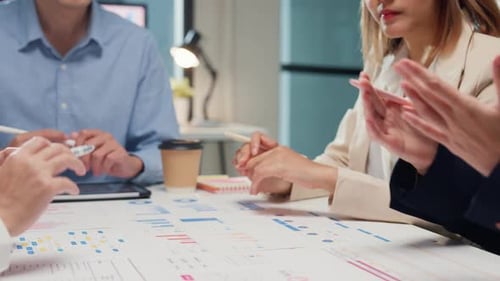 Team Discusses Data in Modern Office Workplace