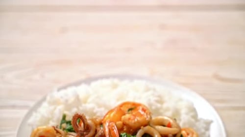 Seafood Stir-Fry with Rice on a Plate