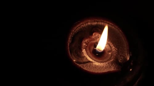 Glowing Diya Lamp on Dark Background