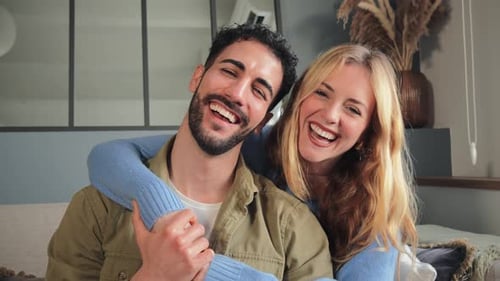 Affectionate Couple Laughing Together Indoors