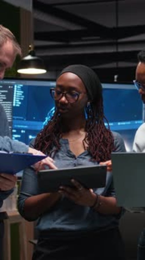 Teamwork in Tech Office: Digital Tablet and Laptop
