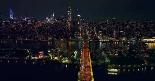Wonderful Queensboro bridge crossing little island and East River. Amazing cityscape of New York
