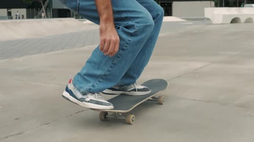 Young Skater Making 360 Flip Jump Performing Kickflip Trick Skateboarder Training in Skatepark
