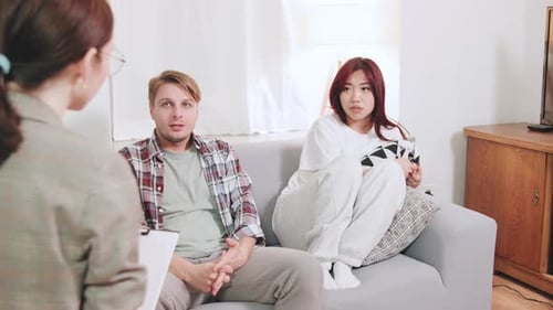 Couple in Therapy Talking with Female Counselor
