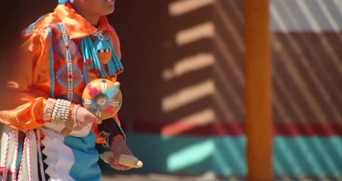 Authentic native american dancers perform traditional rain dance at taos pueblo New Mexico